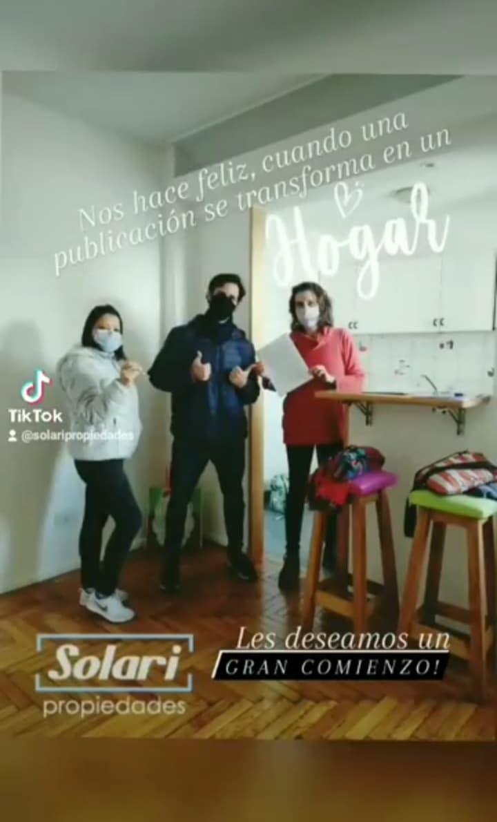 Happy couple with house keys